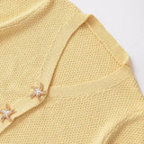 Chaleco de punto de manga corta con botones de estrella de mar