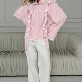 Elegante blusa jacquard con mangas acampanadas y mangas anchas.