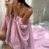 Vestido mini bandeau fluido con dobladillo asimétrico tipo tulipán