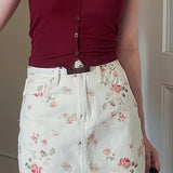 Minifalda ajustada de cintura alta en denim floral vintage