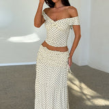 Conjunto de falda larga con bustier de lunares y lazo lateral