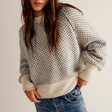 Sudadera oversize con cuello redondo y paneles de lunares.