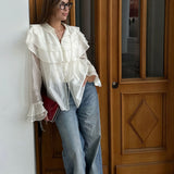 Blusa de gasa de tencel con mangas acampanadas y volantes