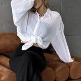 Blusa casual chic lisa de manga larga