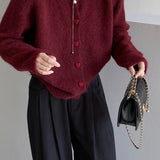 Cárdigan oversize con botones en forma de corazón y cuello redondo