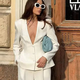 Conjunto de dos piezas de blazer y pantalón blanco con escote en V profundo para la oficina