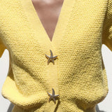 Chaleco de punto de manga corta con botones de estrella de mar