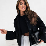 Abrigo de lana liso de moda con bolsillos elásticos y botones a presión.