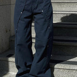 Pantalones cargo de pierna ancha con cintura baja y abertura con tachuelas