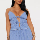 Conjunto de top corto con cuello halter y falda de vendaje con cordones
