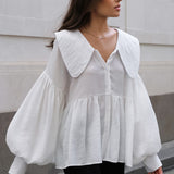 Blusa vintage con cuello bebé plisado y mangas abullonadas