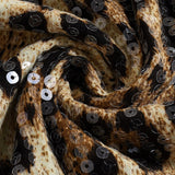 Falda corta elástica con estampado de leopardo y lentejuelas.
