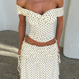 Conjunto de falda larga con bustier de lunares y lazo lateral