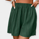 Pantalones cortos elegantes con plisado