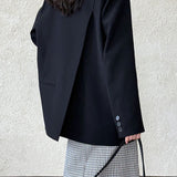 Blazer con espalda abierta y corte relajado