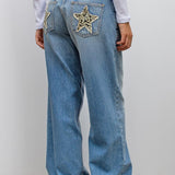 Vaqueros vintage con parche de leopardo y estrella
