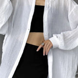 Blusa casual chic lisa de manga larga