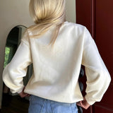 Blusa casual de cuello redondo, estilo suave y chic.