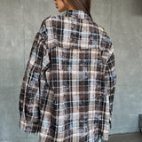 Blusa de cuadros adornada con pedrería