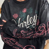 Sudadera vintage con estampado rosa descolorido