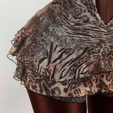 Mini vestido sexy con estampado de leopardo, espalda abierta y volantes