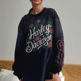Sudadera vintage con estampado rosa descolorido