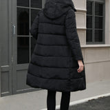 Chaqueta acolchada larga con capucha de talla grande