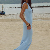 Vestido maxi ajustado, sexy y brillante, sin mangas y con espalda descubierta.