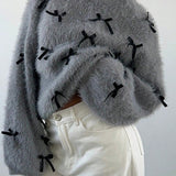 Suéter de mohair con pajarita, blusa holgada