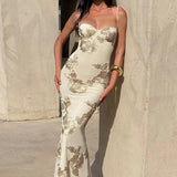 Vestido floral largo, sin espalda y con cierre de lazo.