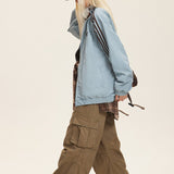 Chaqueta reversible con cuello alto y bloques de color.