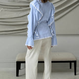 Elegante blusa jacquard con mangas acampanadas y mangas anchas.