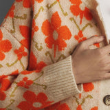 Elegante cárdigan de manga larga en punto jacquard floral