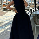 Elegante vestido liso sin mangas con cintura fruncida.