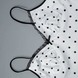 Conjunto sexy de camiseta sin mangas de lunares y falda ajustada