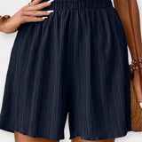 Pantalones cortos elegantes con plisado