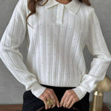Blusa holgada con cuello polo jacquard y mangas largas.