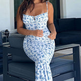Vestido largo ajustado con tirantes finos y estampado floral azul y blanco