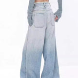 Vaqueros drapeados de cintura alta con efecto degradado desgastado