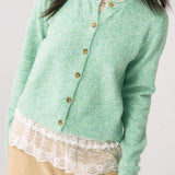 Cárdigan de punto verde chic y elegante con puños.