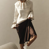 Blusa vintage con mangas acampanadas y volantes