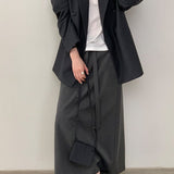 Blazer con cinturón estilo viajero