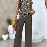 Conjunto de dos piezas para mujer: Top fluido sin mangas, pantalón ancho con estampado floral y tejido transpirable.