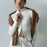 Blusa de punto con doble cremallera y cuello alto