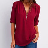 Blusa de mujer – Corte relajado – Cuello en V con cremallera – Mangas abotonadas – Tejido transpirable y fluido