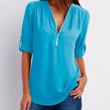 Blusa de mujer – Corte relajado – Cuello en V con cremallera – Mangas abotonadas – Tejido transpirable y fluido