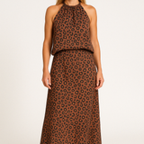 Conjunto de dos piezas para mujer: Top fluido con cuello halter y falda larga estampada.