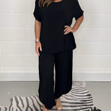 Conjunto informal para mujer: blusa holgada de manga corta y pantalones anchos de pierna ancha.