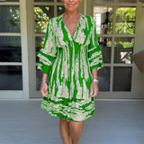 Vestido de mujer - Escote en pico - Mangas 3/4 con volantes - Talle imperio - Corte corto y fluido