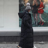 Abrigo acolchado largo, elegante y cómodo para mujer.